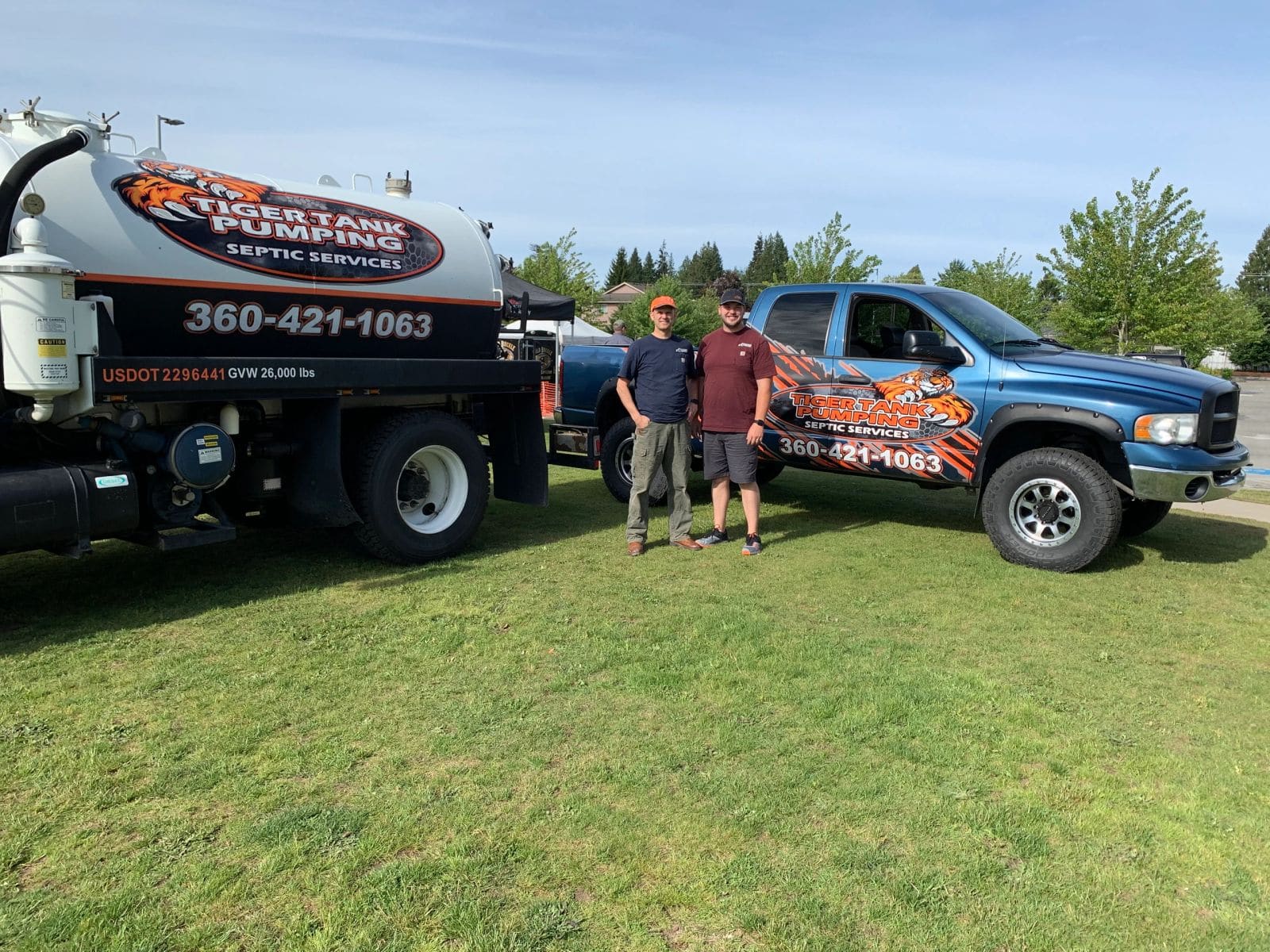 The Yeates family with two Tiger Tank Pumping trucks.